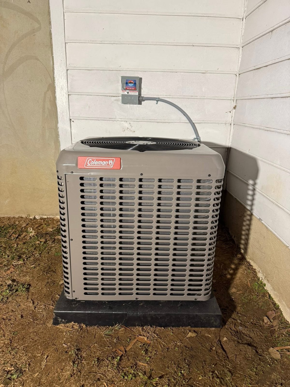 Skyline technician checking outdoor condenser during tune-up