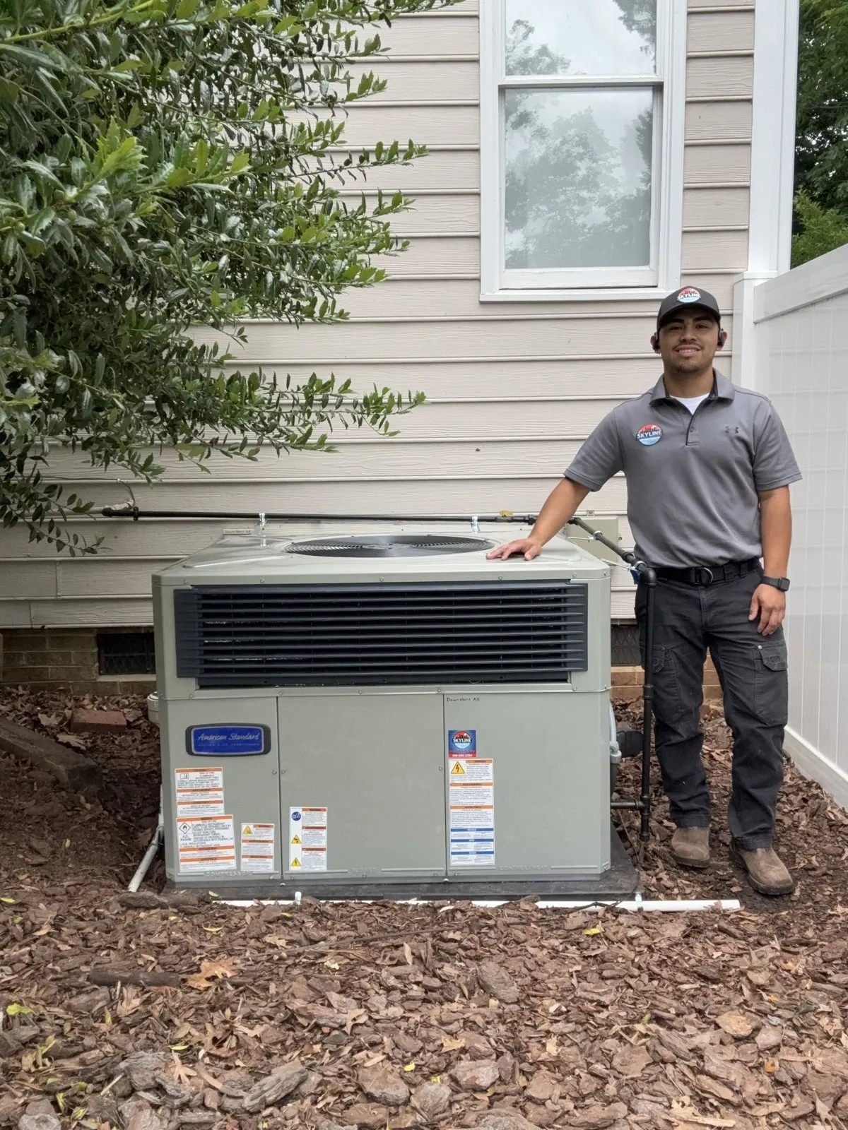Skyline Comfort Services HVAC technician and new air conditioner installation in Raleigh, North Carolina.