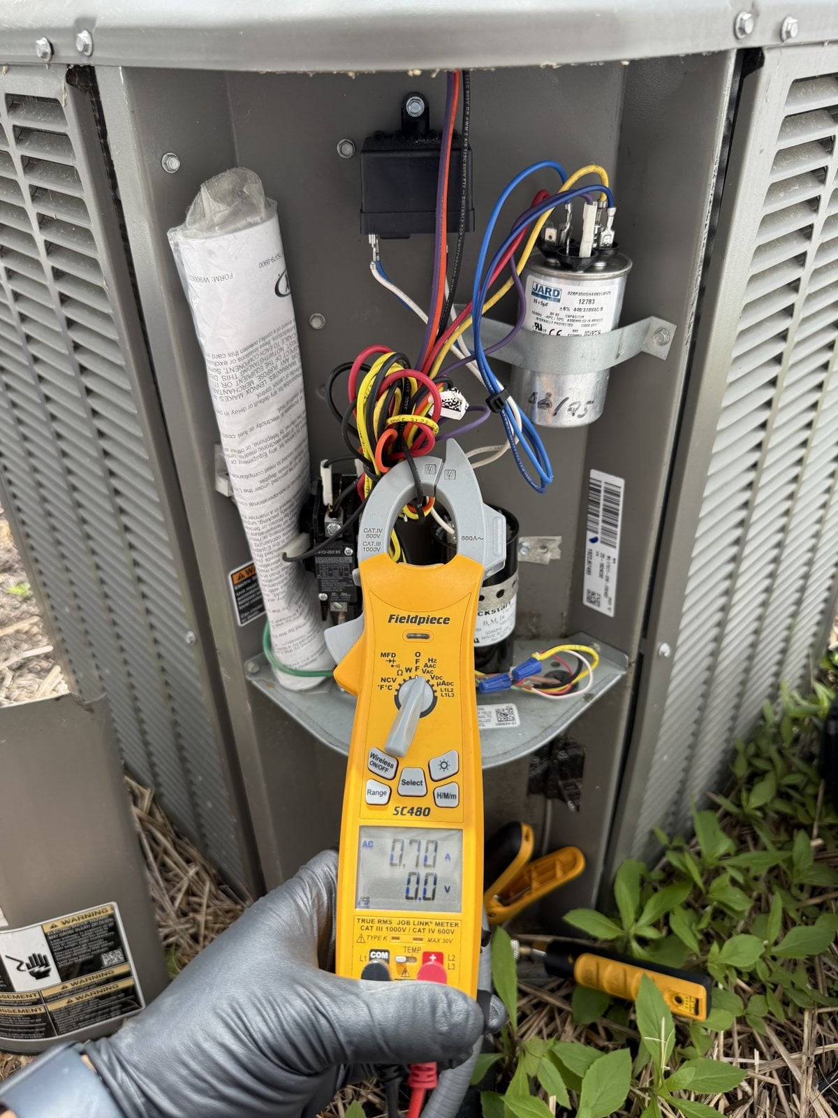 Skyline technician performing heating system service