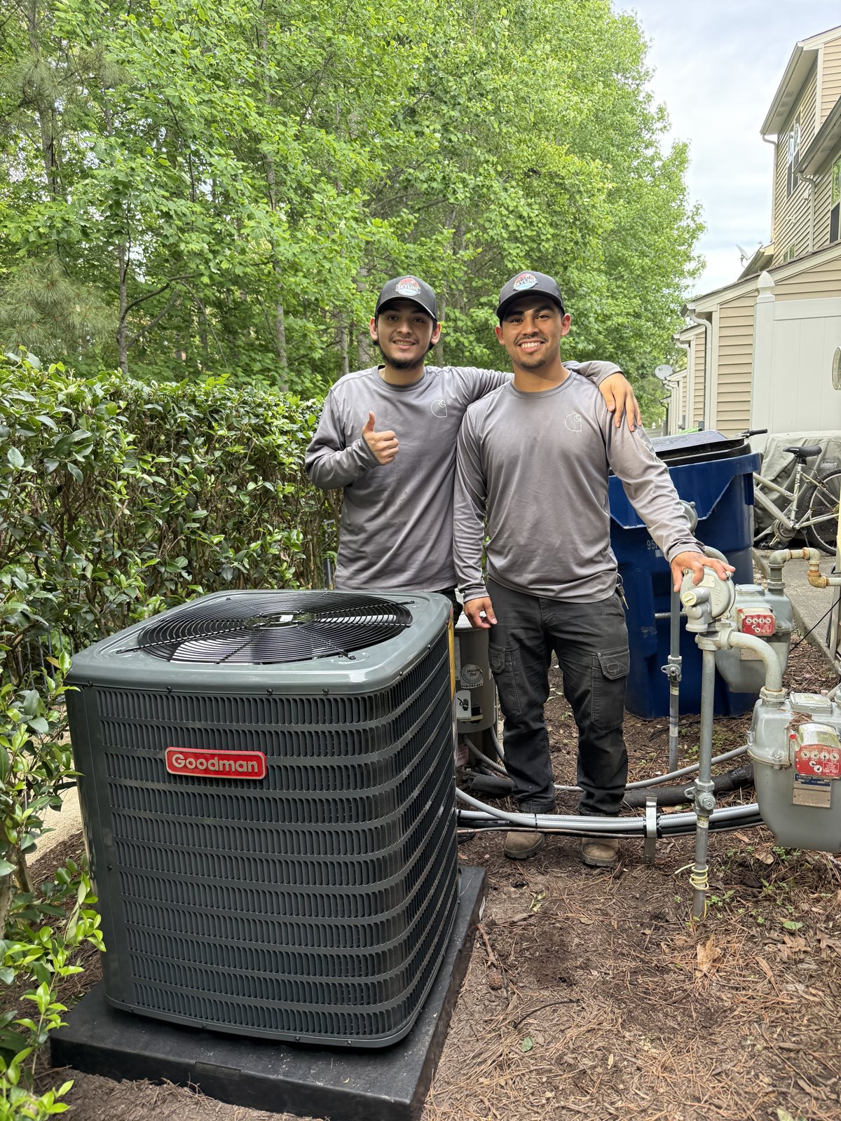 Two Skyline Comfort Services technicians on a heat pump job in the Raleigh Triangle.