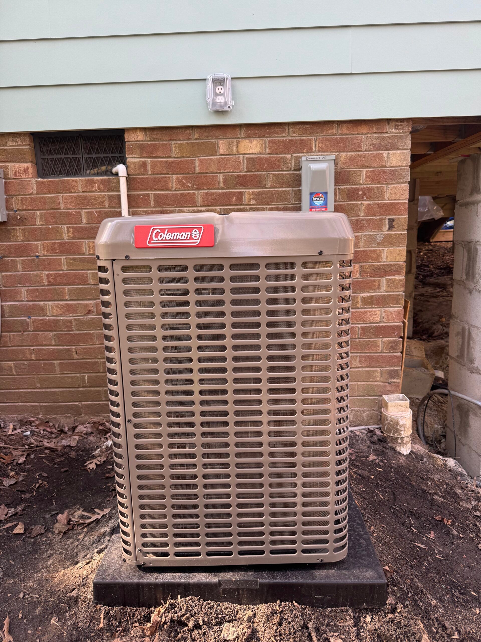 Skyline tech performing AC repair on residential system