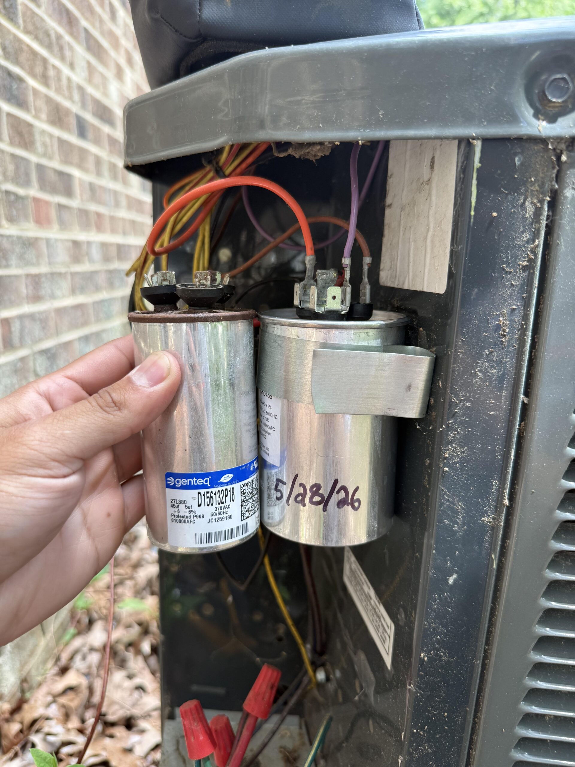 Skyline technician servicing a mini-split system